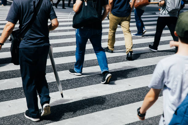 istock Busy crossing people in downtown 1360391488