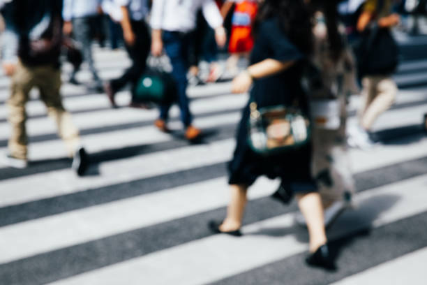 istock Busy crossing people in downtown 1360391714