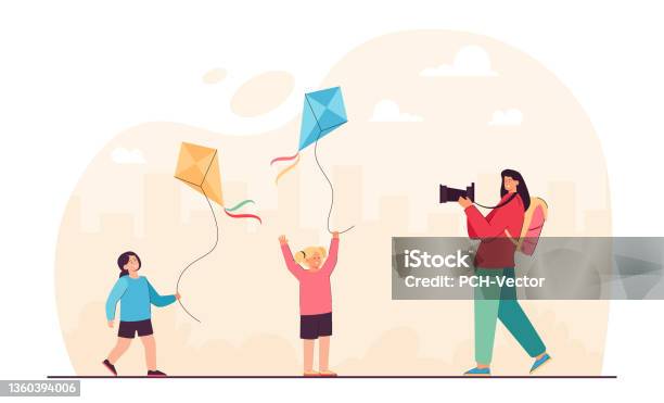 Mother Taking Picture Of Daughters Playing Game With Kites Stock Illustration - Download Image Now