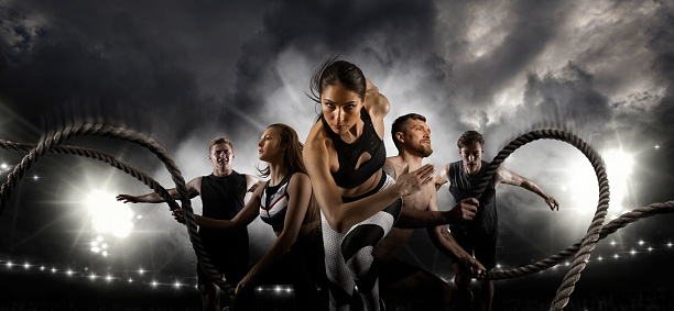 Sport collage. Men and woman running on smoke background. Sports banner. Horizontal copy space background