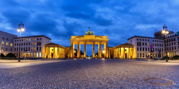 istock Berlin Brandenburger Tor Gate in Germany at night blue hour copyspace copy space panorama 1360396854
