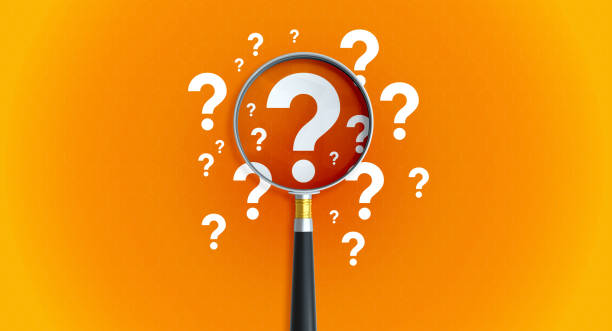 Magnifier And Question Mark On Orange Background stock photo