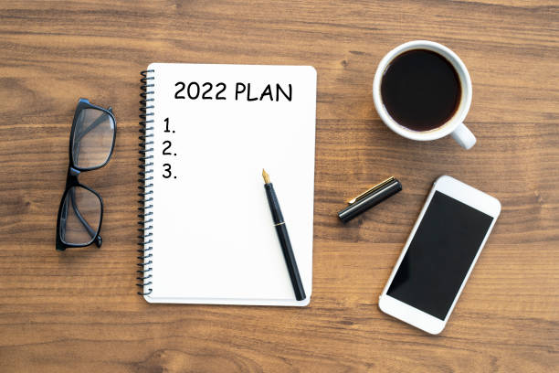istock Notebook with 2022 goals text on it to apply new year resolutions and plan 1360399961