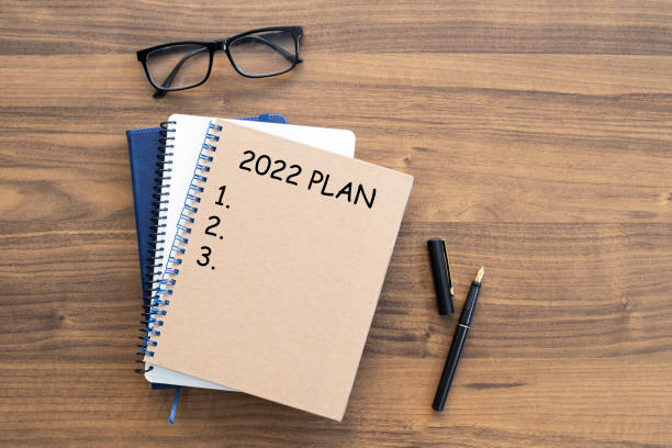 istock Notebook with 2022 goals text on it to apply new year resolutions and plan. 1360399983