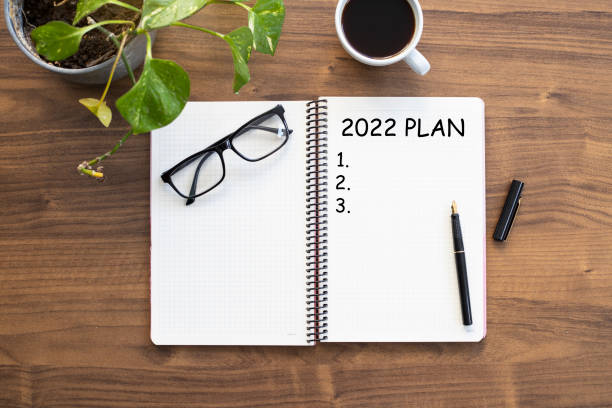 istock Notebook with 2022 goals text on it to apply new year resolutions and plan. 1360399999
