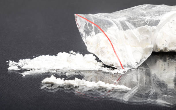 sprinkled white amphetamine powder, concept snuff drug addiction stock photo