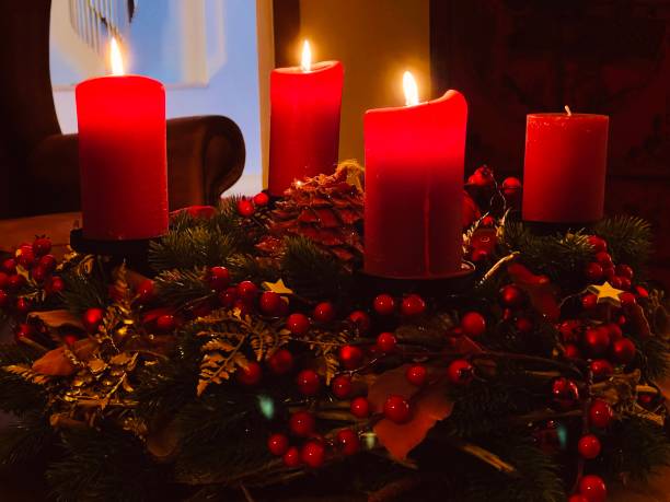 istock Four red candles burning on the advent wreath 1360401219