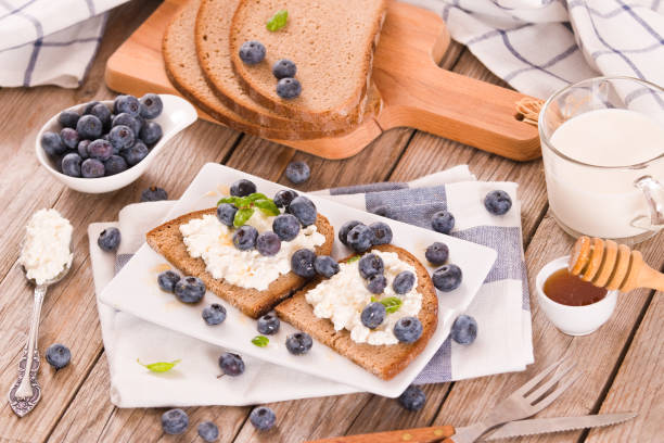 istock Rye bread with cottage cheese, blueberries and honey. 1360402658