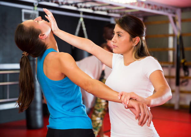 istock Womens sparring in self defense courses in gym 1360403086