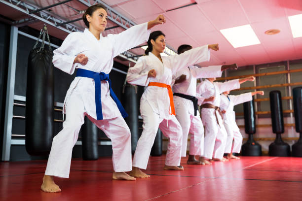istock Polyethnic men and women in kimono exercising kata 1360403110