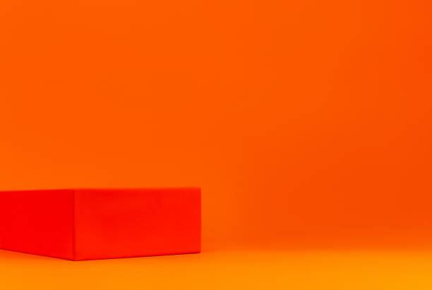 minimal modern cosmetic product display geometrical podium demonstrating orange background. empty pedestal shelf display - orange wall imagens e fotografias de stock