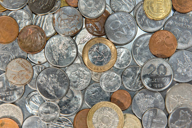 istock Texture background of old coins from different countries. Top view. 1360405406