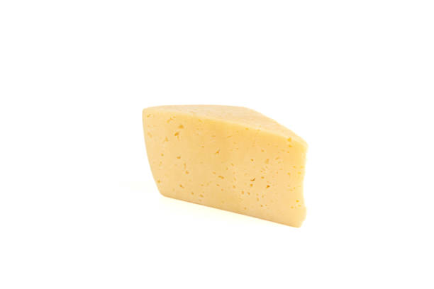 istock A piece of hard cheese isolated on a white background. 1360405425