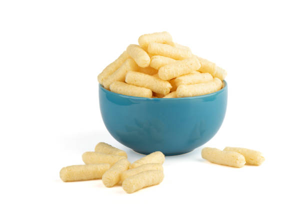 istock Sweet corn sticks in a blue cup and a few on a white background. 1360405477