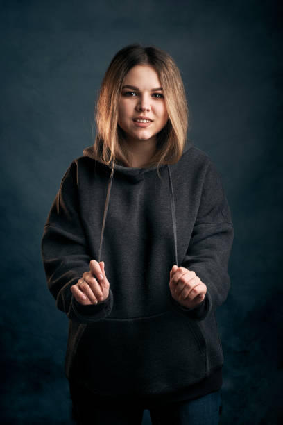 istock Woman portrait studio shot on blue background 1360405769