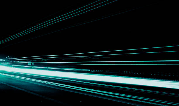 istock blue car lights at night. long exposure 1360406588