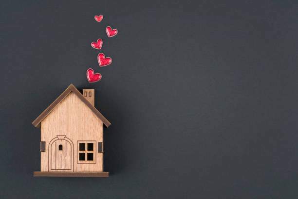 istock Wooden house  and  red heart shape 1360407478