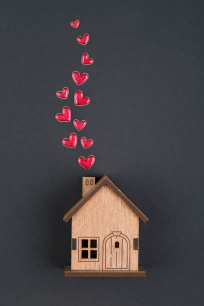 istock Wooden house  and  red heart shape 1360407553
