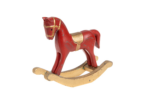 Red vintage rocking horse, isolated on white