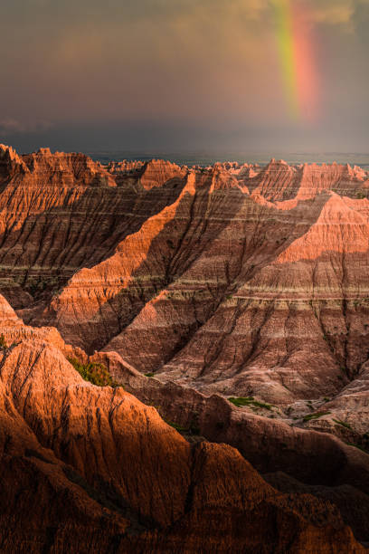 Rainbow in Badlands at Sunset stock photo