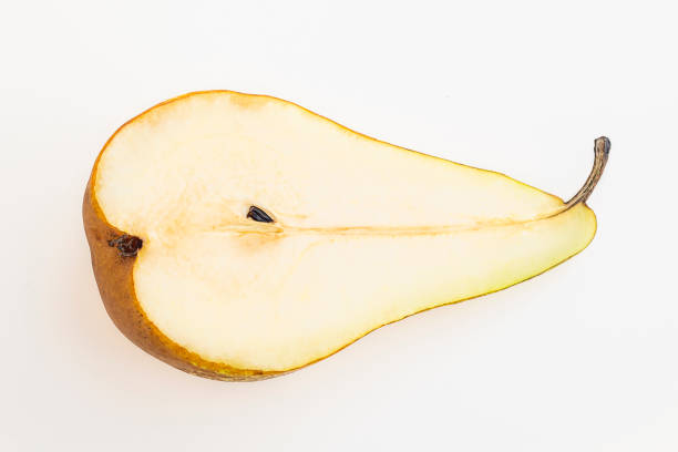 istock Fresh pears, a half yellow fruit isolated on white background 1360413828