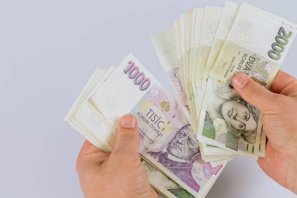 istock Czech koruna banknotes in the hands of a man 1360414908
