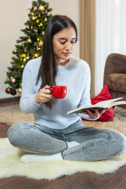 istock Women reading book and drinking coffee 1360417461