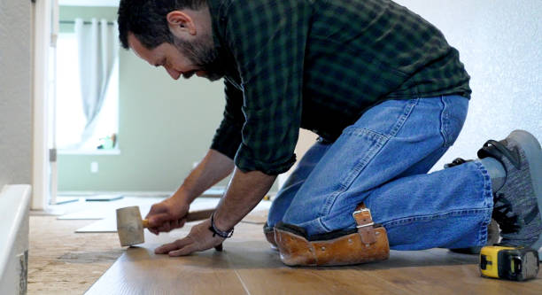 istock Installing wooden vinyl floor 1360417972