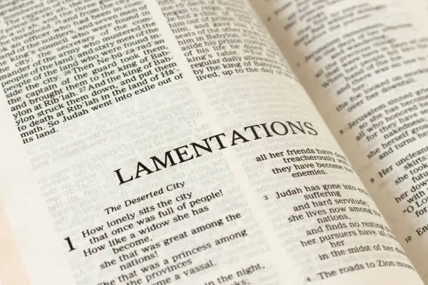 Lamentations Holy Bible Book Old Testament close-up. Christian biblical concept of prophecy by God and Jesus Christ. Open Scripture for studying.