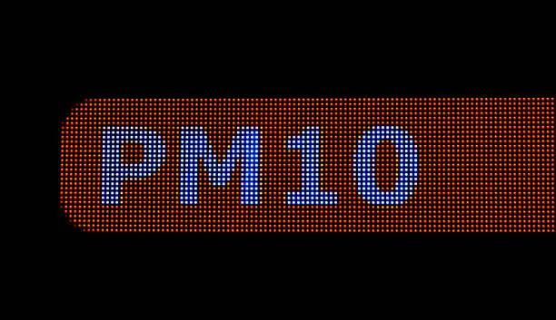 Photo of Particulates, urban city particulate matter air pollution PM 10 larger particles, electronic LED display closeup. PM10 text sign. Bad unhealthy dangerous air quality factors, emission concept, nobody
