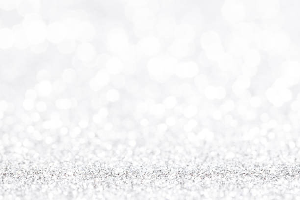 istock Bokeh gray background. Silver abstract bokeh snow falling winter christmas holiday background 1360420691