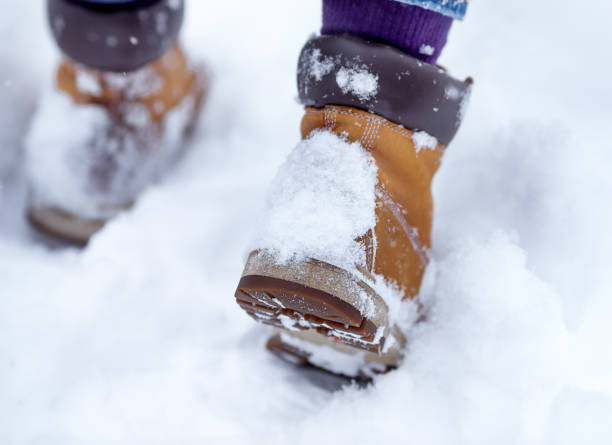 istock Man walks in the snow 1360421563