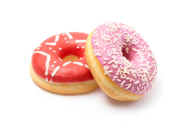 istock Delicious, colorful donuts on white background 1360422851