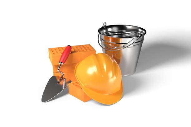 istock 3d render illustration clay bricks, yellow worker hat, bucket and cement trowel isolated on white background. Realistic new red perforated ceramic bricks, bricklayer trowel and safety yellow helmet. 1360426488