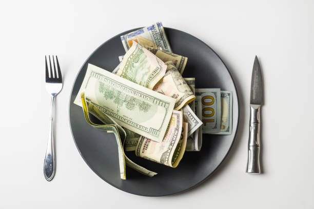 istock US Dollars on the plate with fork and knife 1360426533