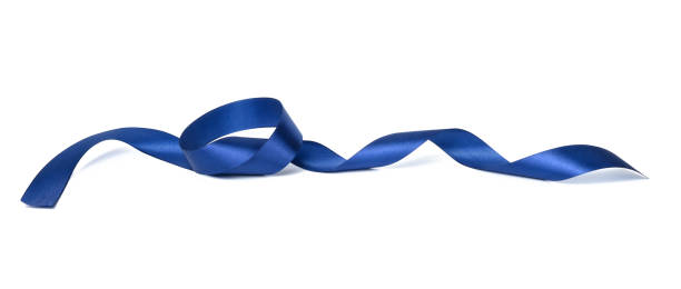 istock swirling blue silk ribbon on white background, gift wrapping decor 1360428403