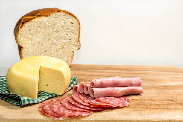 istock Colonial breakfast served with bread, cheese, ham and salami. 1360432209