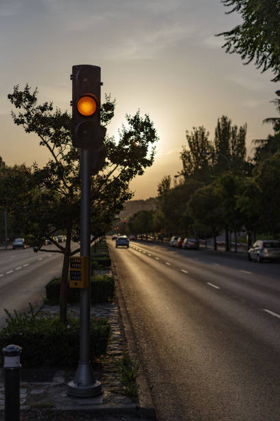 Madrid Spain. August 22, 2021. Amber traffic light at sunset