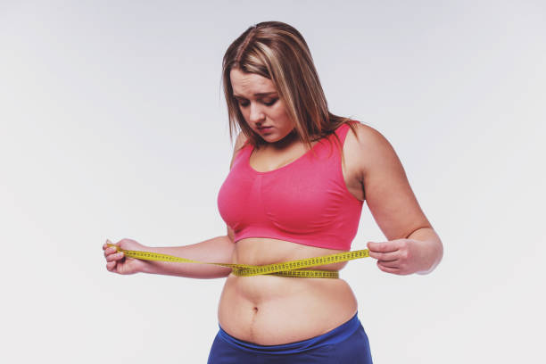 istock Fat woman dieting 1360434422