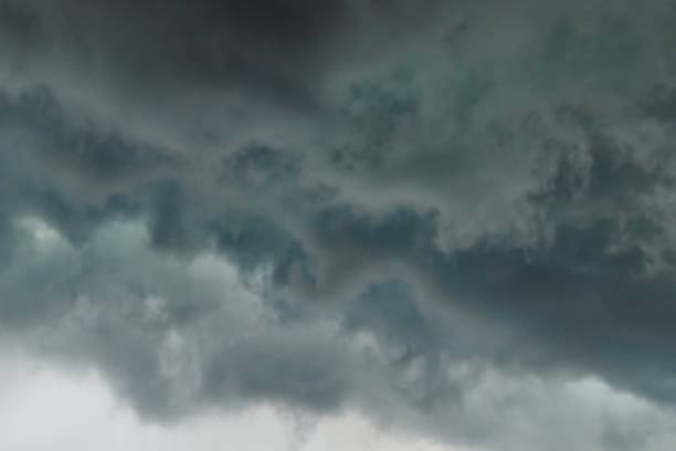 istock layers of storm clouds, pushed by the winds on the horizon. 1360434519