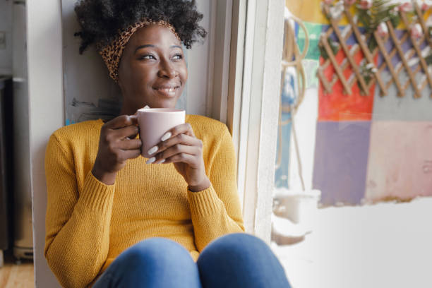istock Enjoying the morning coffee by the window 1360435321