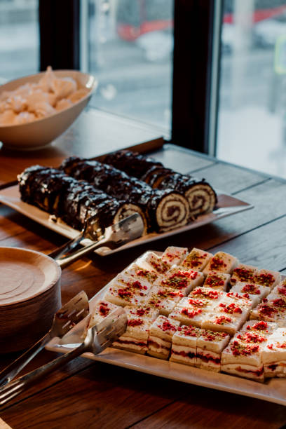 Delicious cakes on the catering table. Small pieces of cake. Coffee break.