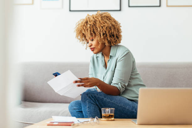 istock Home Office: An Afro-American Woman Using a Mobile Phone 1360438522