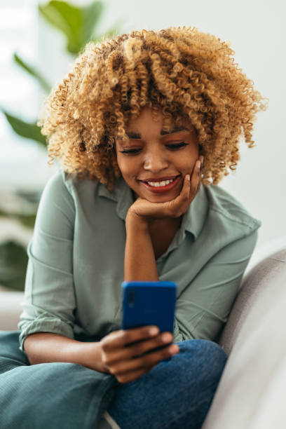 istock Afro-American Woman Using a  Smartphone 1360438572