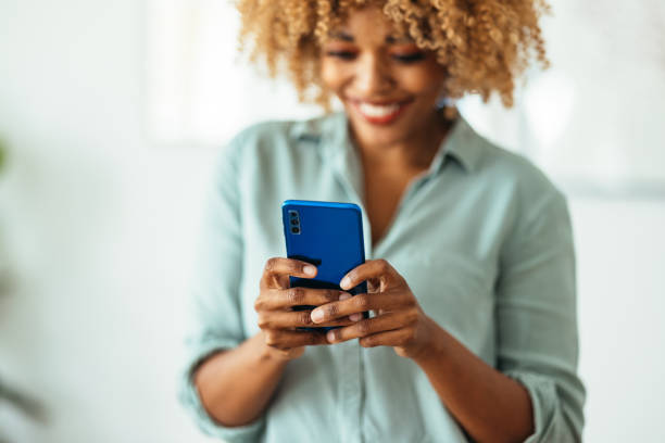 istock Afro-American Woman Using a Smartphone 1360438599