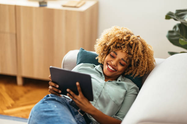 istock Afro-American Woman Using a Digital Tablet 1360439127