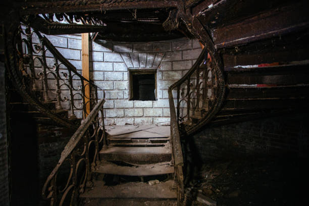 istock Old rusty staircase at the old ruined abandoned mansion 1360441241