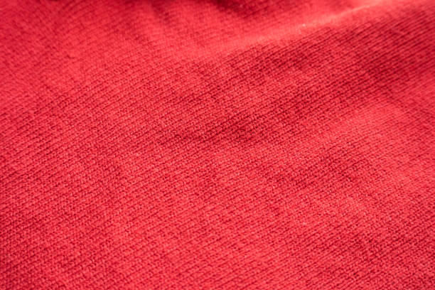 istock closeup red knitted woolen fabric texture background 1360448625