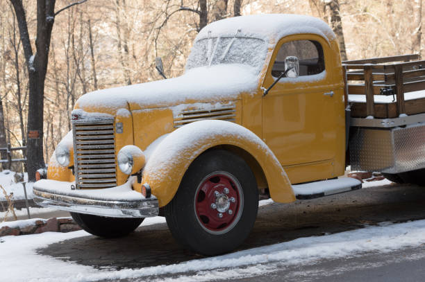 Near Sedona, Coconino County Arizona, USA - December 15, 2021: restored 1940s International Harvester truck on display shown snow dusted.