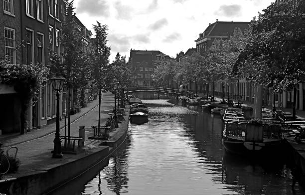 istock Canal scene in black and white in Leiden, Netherlands 1360453291